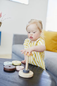 Girl playing with stacking tower