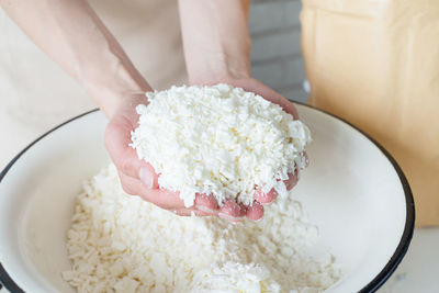 Midsection of woman holding dessert