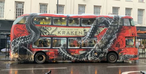 Graffiti on wet street in city