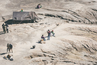 High angle view of hikers in volcanic land