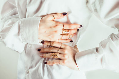 High angle view of woman hands over white background