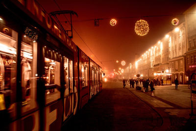 View of illuminated people at night