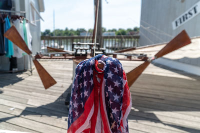 Close-up of flags hanging on boat on sunny day