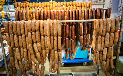 Clothes hanging for sale at market stall