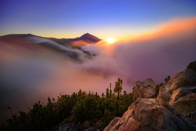 Scenic view of mountains against sky during sunset