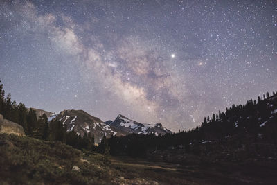 Milkway and a planet over the sierra mountains outside yosemite national park