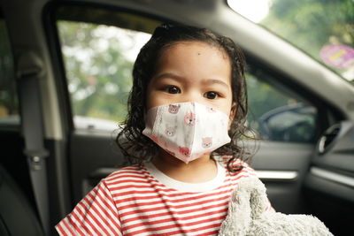 Portrait of girl in car