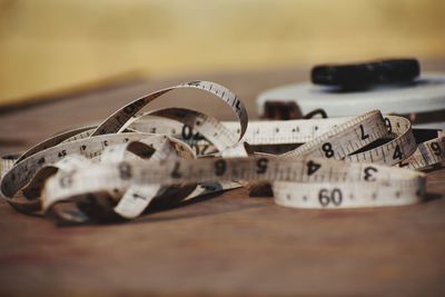 Close-up of tape measure on table