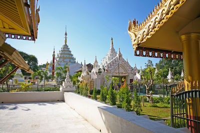 View of temple against buildings