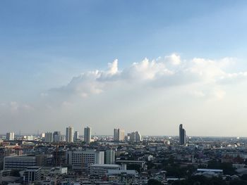 Modern buildings in city against sky