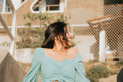 Young woman looking away outdoors