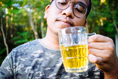 Portrait of man drinking glasses