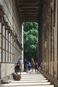 People walking on corridor of building