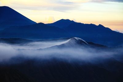 Scenic view of mountains against sky during sunset