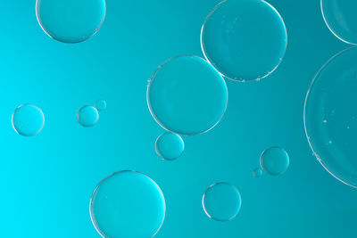 Close-up of drops against blue background