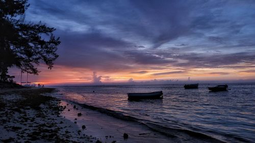 Scenic view of sea against sky at sunset