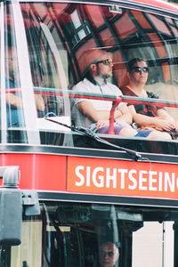 Reflection of people on glass window