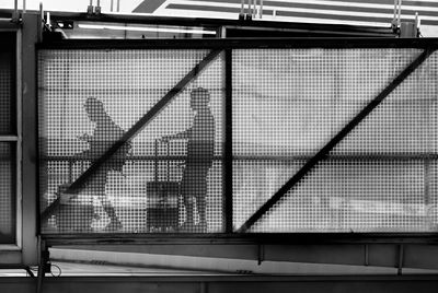 Low angle view of building seen through window