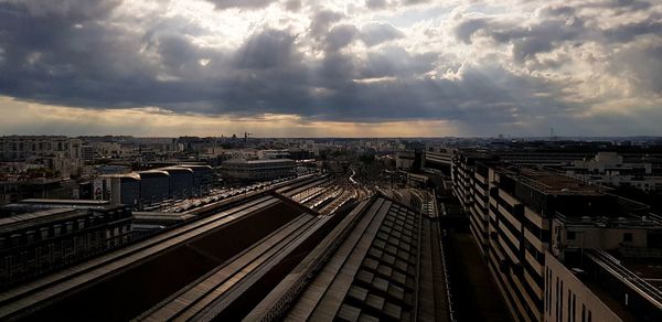 High angle view of railroad tracks amidst buildings in city