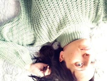 Portrait of baby lying on bed