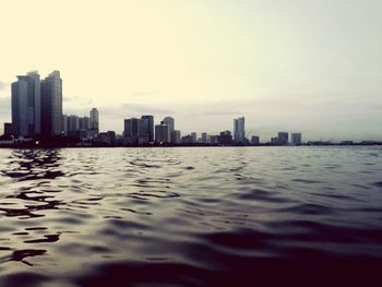 City skyline against sky during sunset