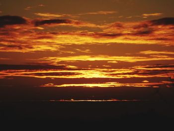 Scenic view of dramatic sky during sunset