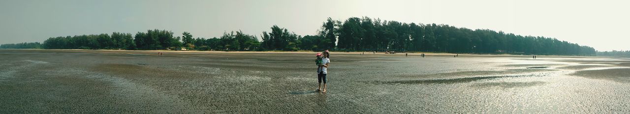 Silhouette of woman on shore