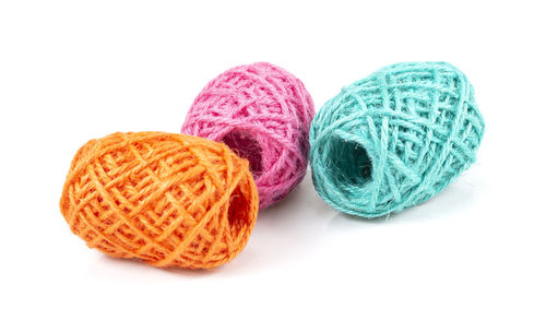 Close-up of multi colored candies against white background