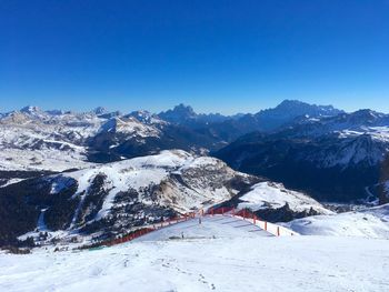 Scenic view of mountains against clear blue sky