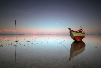 Scenic view of sea against sky at sunset