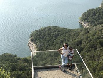 High angle view of woman looking at sea