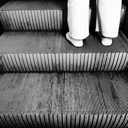 Low section of woman standing on steps