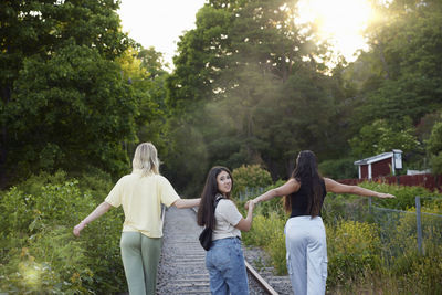 Happy female friends spending time together outdoors
