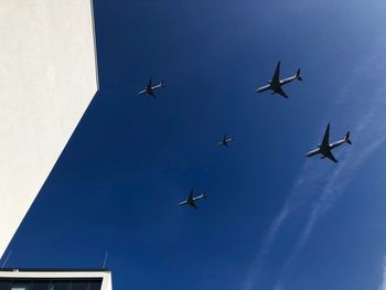 Low angle view of airplane flying in sky