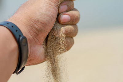 Close-up of human hand on the wall