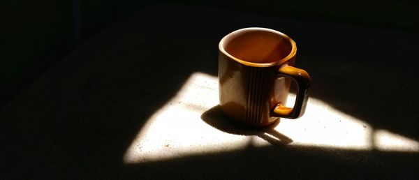 High angle view of coffee cup on table