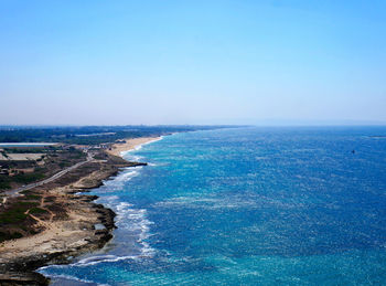 Scenic view of sea against clear blue sky