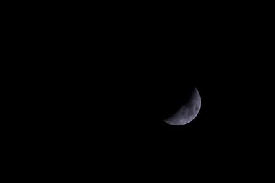 Low angle view of moon against sky at night