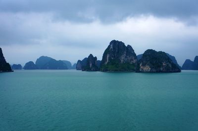 Panoramic view of sea and mountains against sky