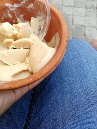 Close-up of hand holding ice cream