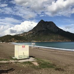 Built structure on beach against sky