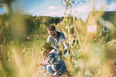 Full length of man sitting on field