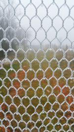 Chainlink fence covered with snow