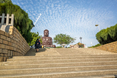 Steps leading towards temple against building