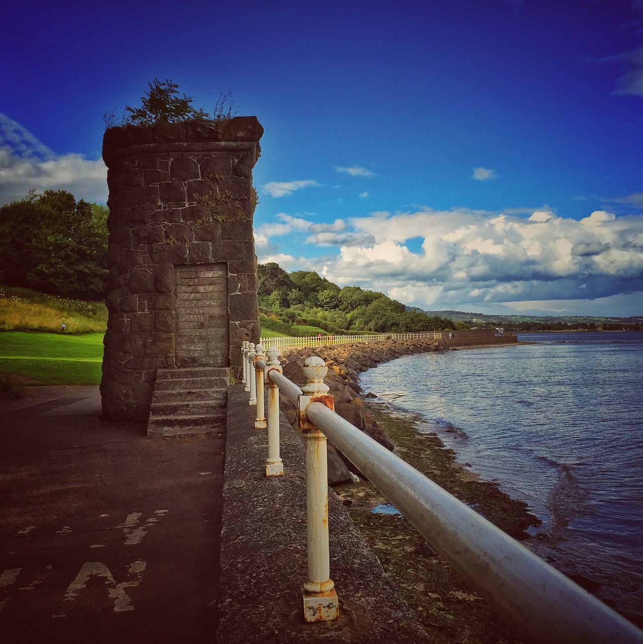 water, sky, built structure, architecture, blue, sea, tranquility, nature, history, tranquil scene, old, connection, scenics, cloud - sky, day, cloud, river, outdoors, bridge - man made structure, no people