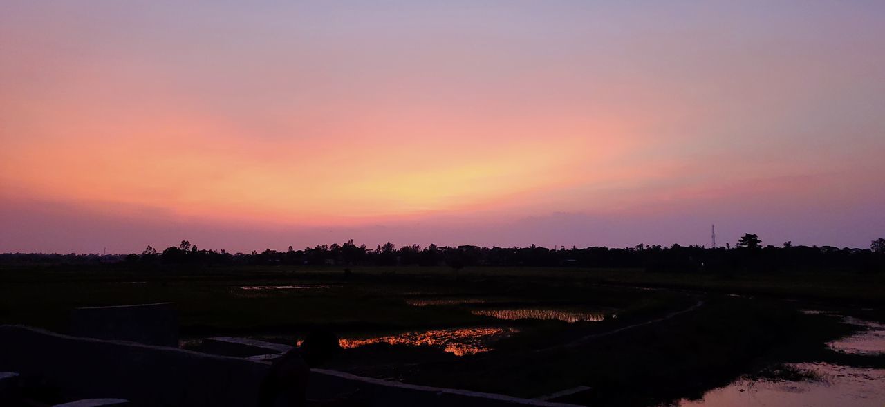 sky, dawn, sunset, evening, horizon, landscape, environment, nature, afterglow, scenics - nature, beauty in nature, no people, tranquility, cloud, water, silhouette, tranquil scene, red sky at morning, orange color, outdoors, land, architecture, plant, purple, reflection, sun, travel