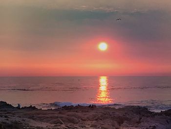 Scenic view of sunset over sea