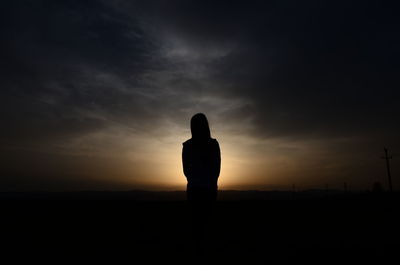 Silhouette of man against sky during sunset