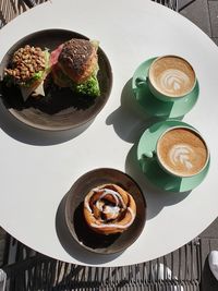 High angle view of coffee served on table