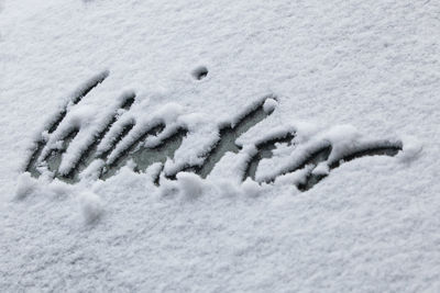 Close-up of snow covered windshield